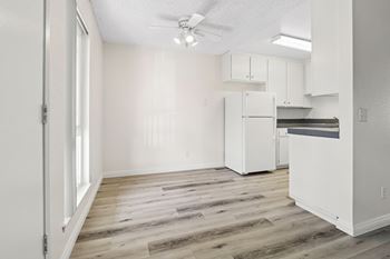 Separate dining space with airy ceiling fans